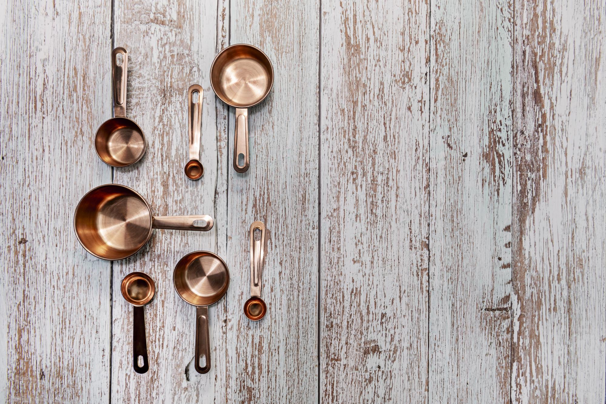 Light-filled kitchen workspace with copper pans